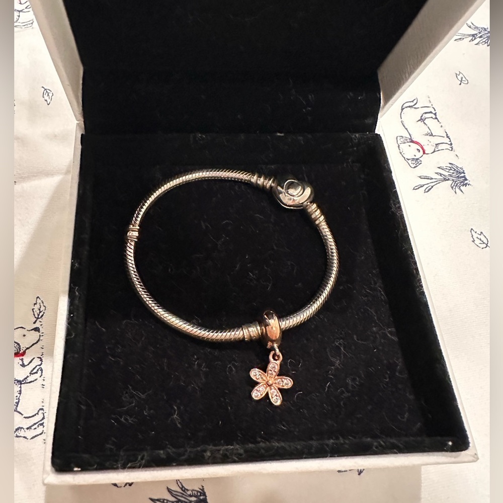 Pandora bracelet with heart clip and gold flower charms